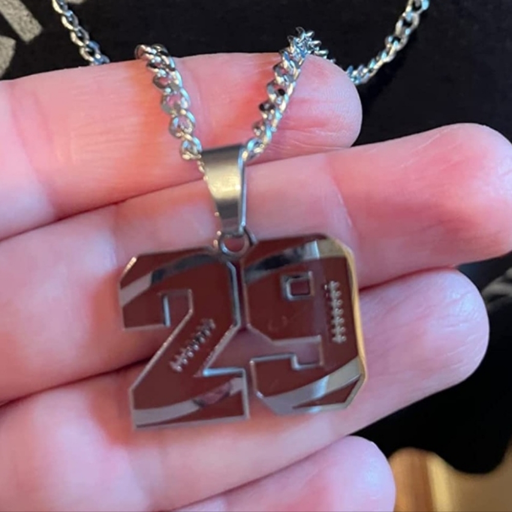 Stainless steel football number necklace. All numbers usually avail. Please ask.